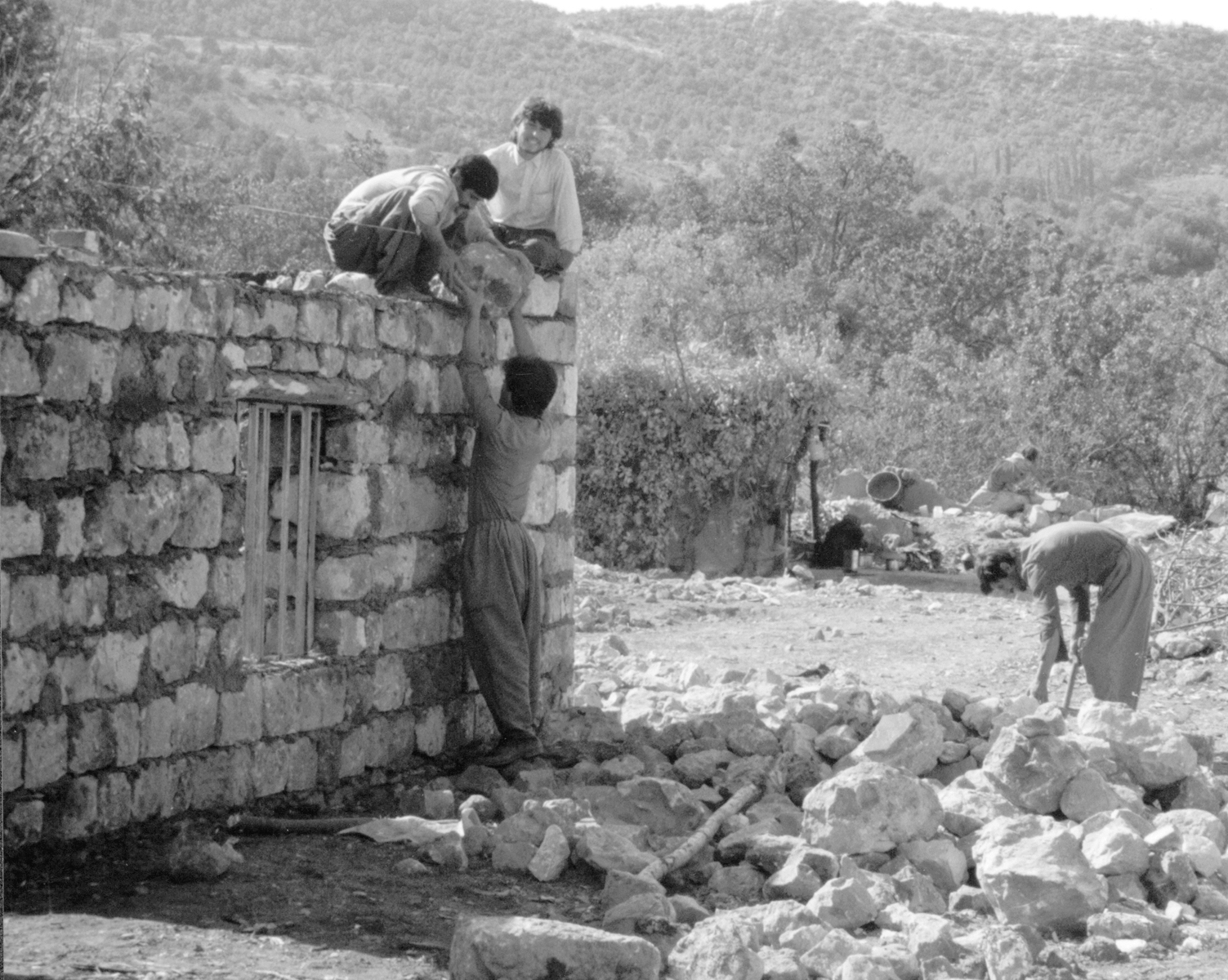 Kurdish men building small