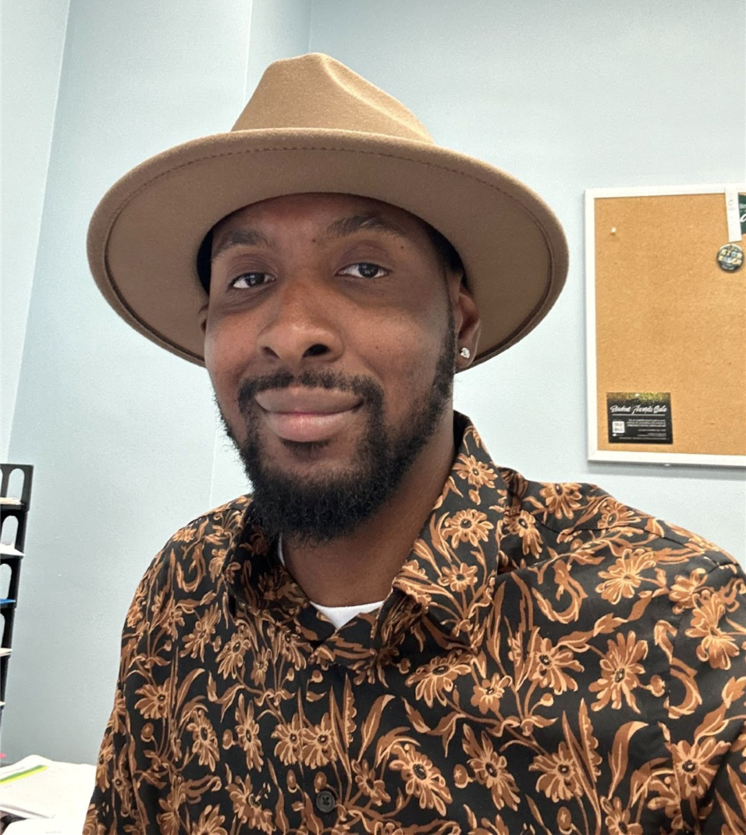 selfie photograph of Andre Mathis, Bartle Library Services Manager, in decorative shirt and tan hat