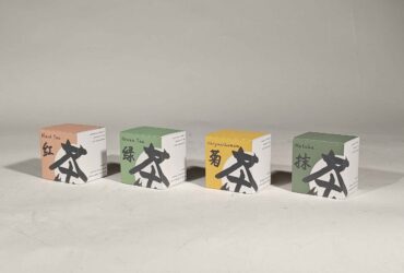 Sammy Feng's book arts work "Cha" comprised of four boxes resembling tea packaging with English and Chinese text indicating four varieties of tea: black tea, green tea, chrysanthemum and matcha.