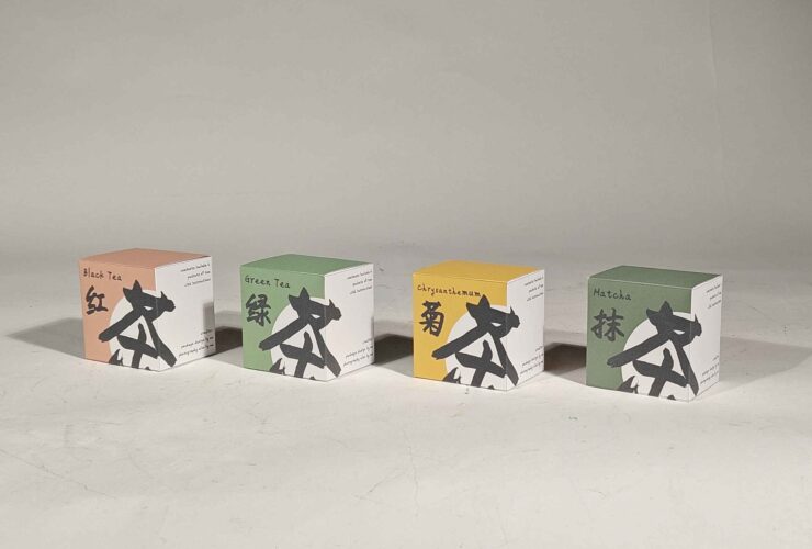 Sammy Feng's book arts work "Cha" comprised of four boxes resembling tea packaging with English and Chinese text indicating four varieties of tea: black tea, green tea, chrysanthemum and matcha.
