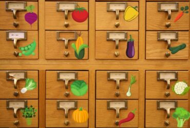 Card catalog with vegetable stickers near the drawer pulls.