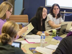 faculty engages in a research discussion