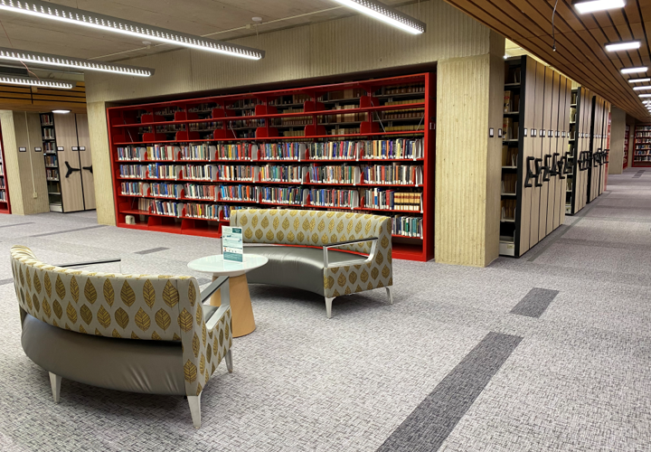 ground floor of the library featuring couch seating in front of moveable bookshelves