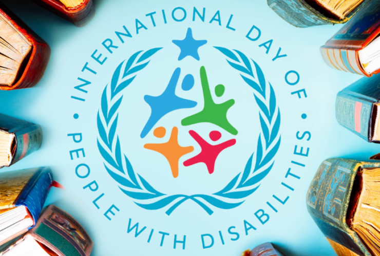 Photo of a circle of books with the logo for International Day of People with Disabilities in the center.