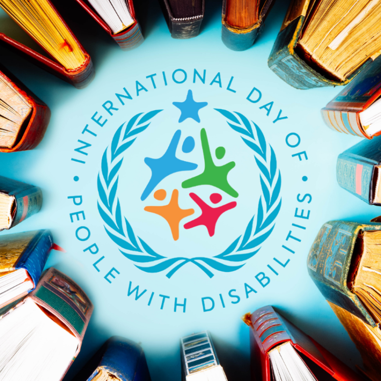 Photo of a circle of books with the logo for International Day of People with Disabilities in the center.