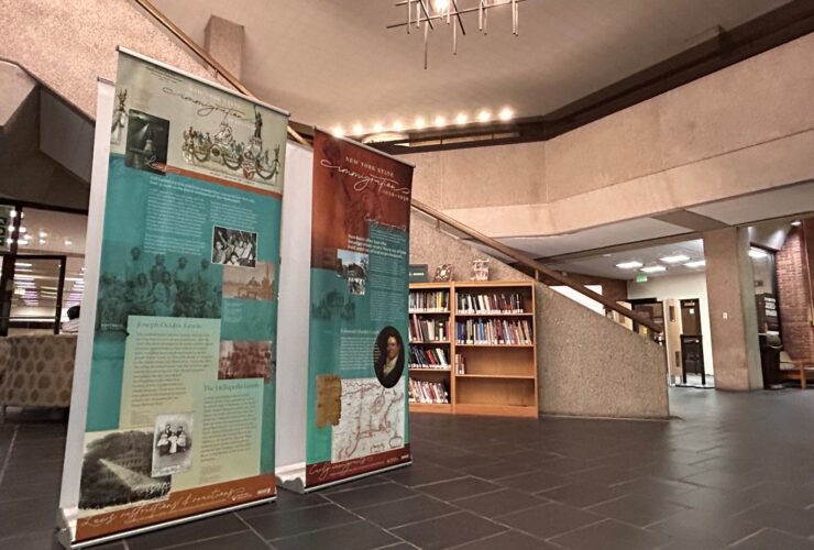 photo of the SCRLC traveling exhibit "Immigration in New York State, 1650-1950" set up in the Bartle Library lobby.