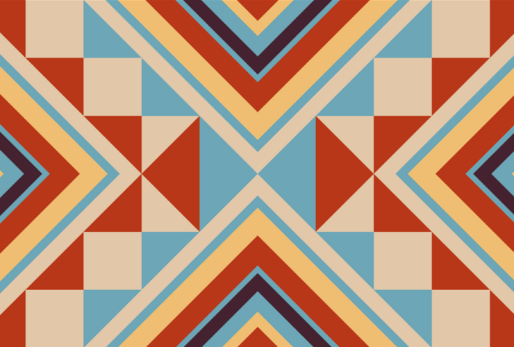 Decorative Native American inspired pattern featuring orange, blue and tan triangles of various sizes.