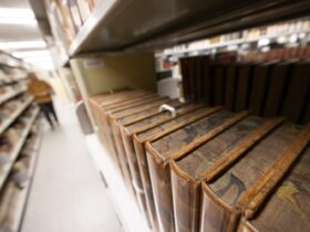 closeup of a bookshelf in Special Collections displaying some of the rare books in the collections.