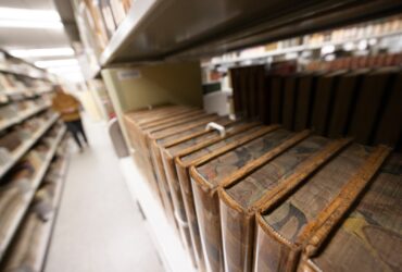 closeup of a bookshelf in Special Collections displaying some of the rare books in the collections.