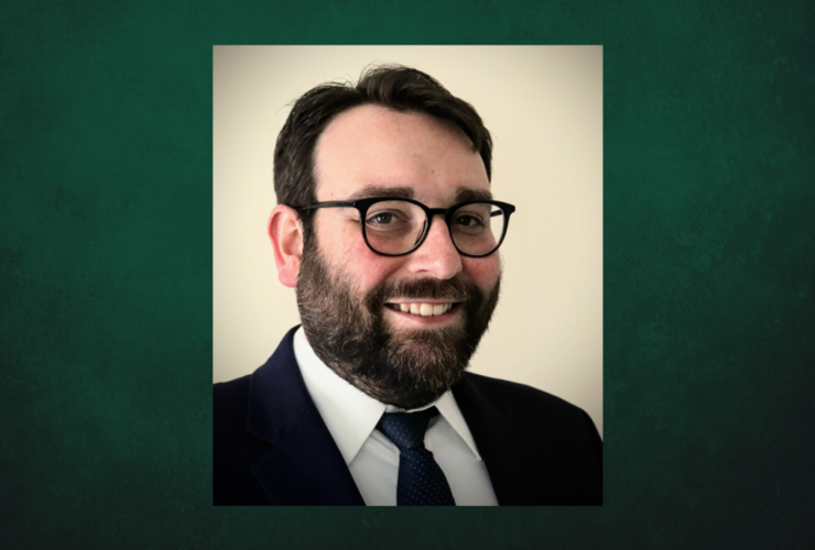Professional Headshot of Kevin Seeber on a dark green background