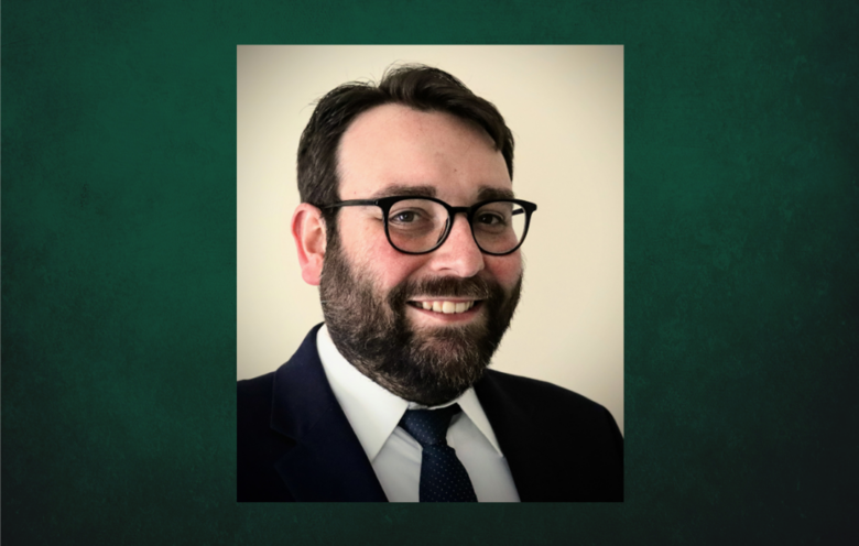 Professional Headshot of Kevin Seeber on a dark green background