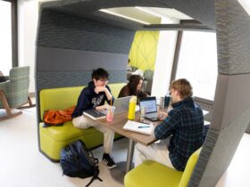 Photo of students sitting at a work booth on the third floor of Bartle Library.