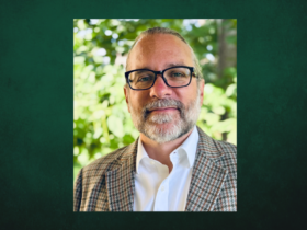 Professional Headshot of Jesse Koennecke on a dark green background