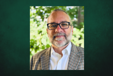 Professional Headshot of Jesse Koennecke on a dark green background