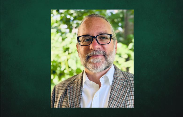 Professional Headshot of Jesse Koennecke on a dark green background