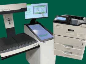 photos of a book eye scanner and printer set on a solid background.
