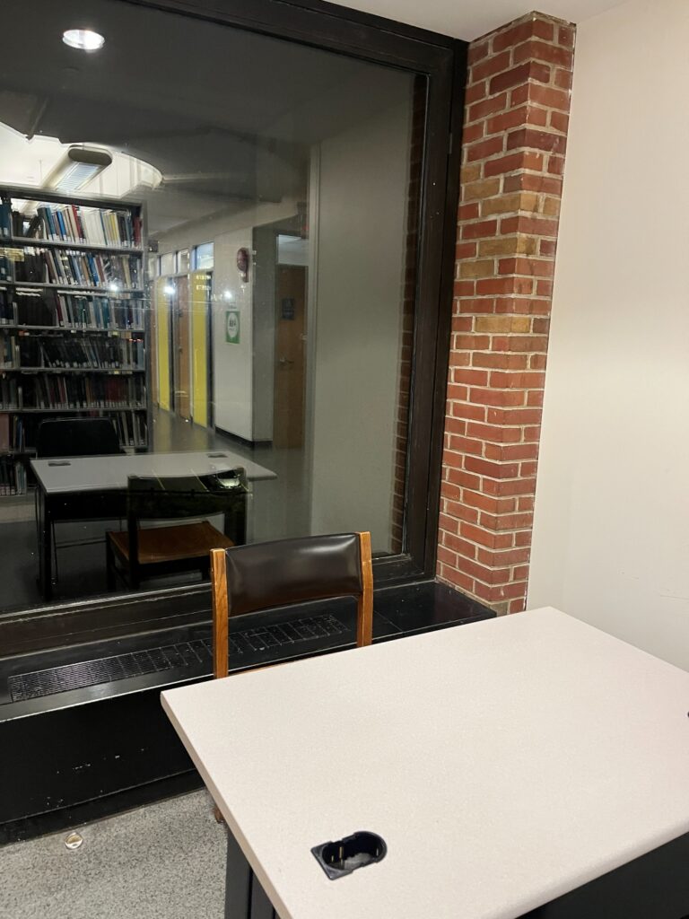A working desk next to a window on the fourth floor of Bartle Library.