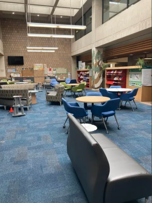 Photo of the Atrium in Science Library featuring various couches, tables and seating styles.