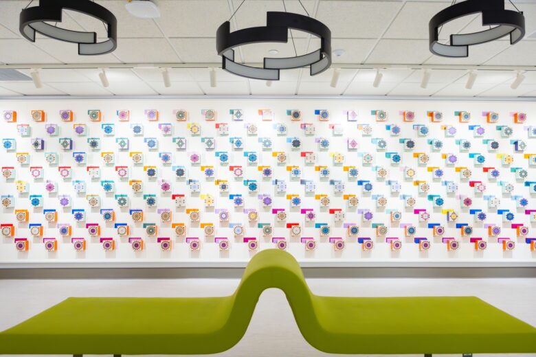 Photo of Art Installation on the Bartle Library 3rd floor Gallery Space featuring 3D blocks with various patterns and colors installed on the wall.