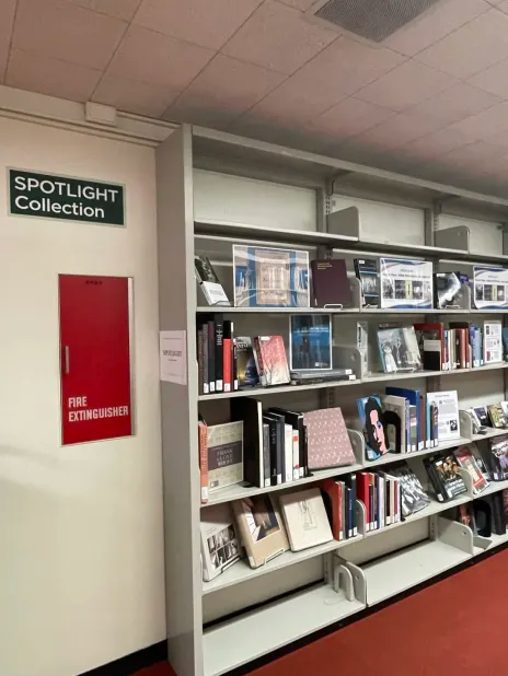 Photo of the SPOTLIGHT Collection with various books and music on display at the entrance to the Fine Arts Collection.