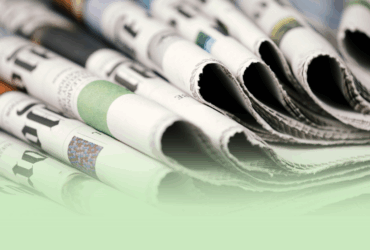 a stack of folded over newspapers