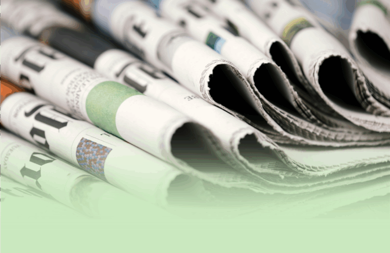 a stack of folded over newspapers