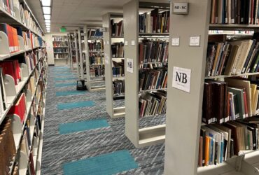 Bookshelves with the newly installed carpet in Bartle Library North first floor.